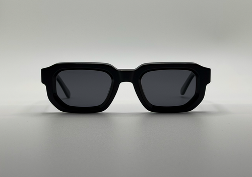 Black sunglasses on a gray background