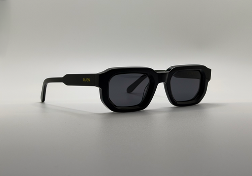 Black sunglasses on a gray background