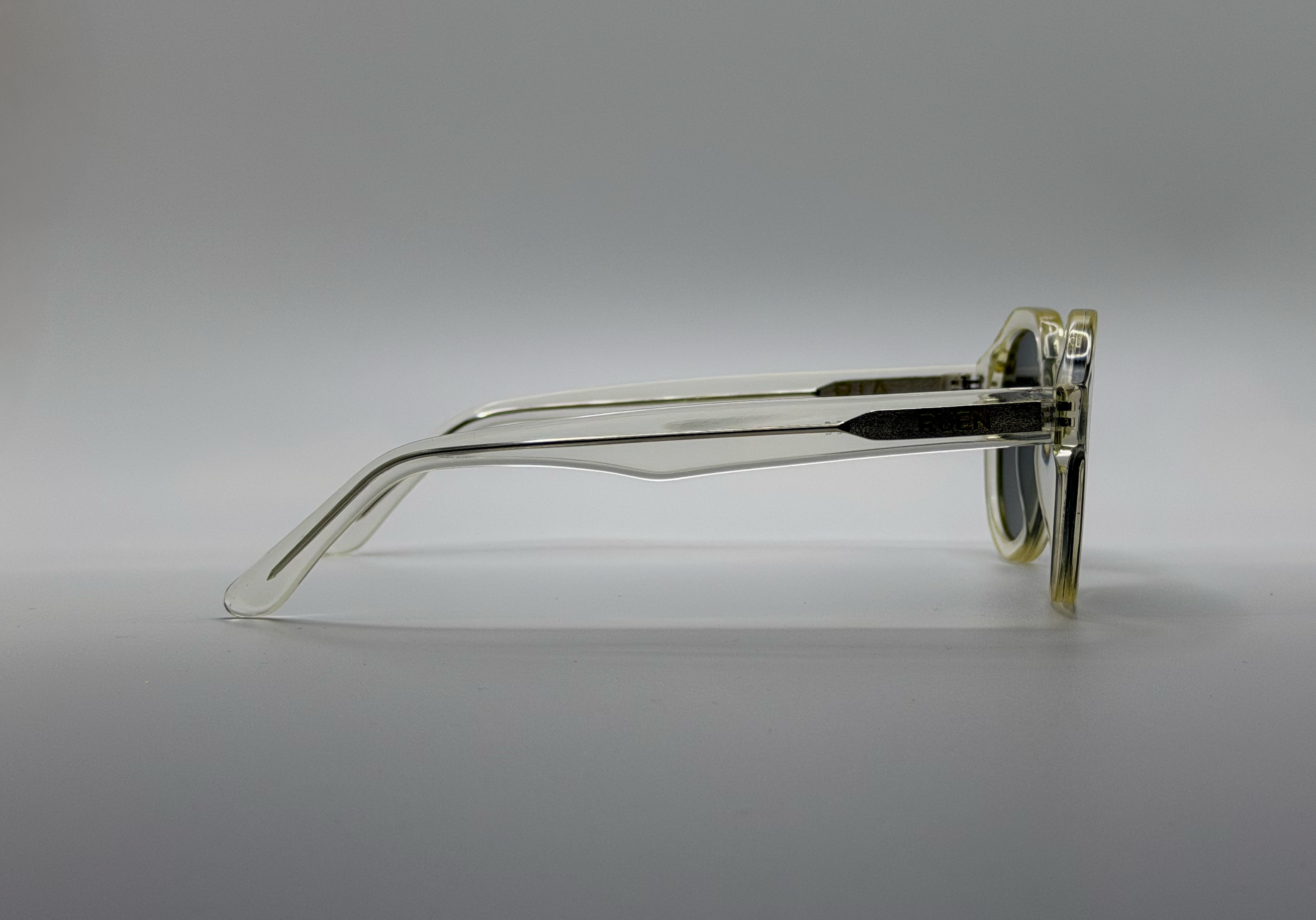 Clear eyeglasses on a gray background