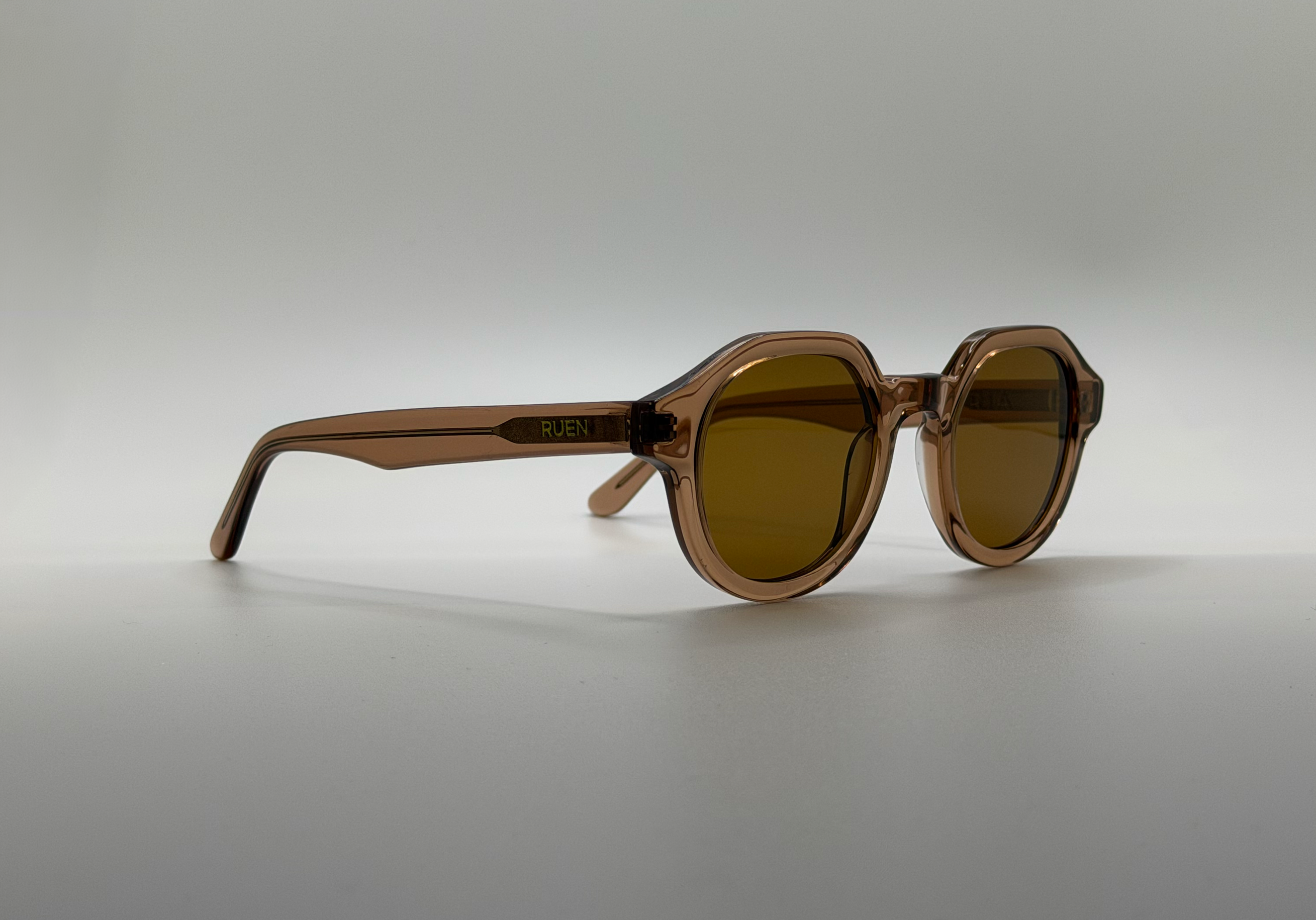 Brown sunglasses on a gray background